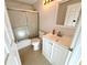 Bathroom featuring a shower with sliding glass door and white vanity sink at 9614 Long Meadow Dr, Tampa, FL 33615