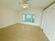 Bright bedroom with a ceiling fan and bay window overlooking the outside at 9614 Long Meadow Dr, Tampa, FL 33615