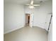 Spacious bedroom with fan, and ceramic tile flooring at 9614 Long Meadow Dr, Tampa, FL 33615