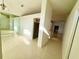 Bright foyer with tile flooring, large mirror, and open access to adjacent living spaces at 9614 Long Meadow Dr, Tampa, FL 33615