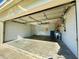 Attached garage with storage and sink area at 9614 Long Meadow Dr, Tampa, FL 33615