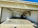 Attached garage with storage and sink area at 9614 Long Meadow Dr, Tampa, FL 33615