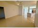 Open living room showcasing neutral paint and glossy tile flooring at 9614 Long Meadow Dr, Tampa, FL 33615