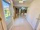 Inviting sunroom filled with bright windows and glossy tile floors at 9614 Long Meadow Dr, Tampa, FL 33615