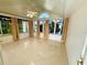 Bright sunroom with large windows providing great natural light and views at 9614 Long Meadow Dr, Tampa, FL 33615