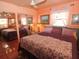 Serene bedroom with a comfortable bed, mirrored closet, and ample natural light at 100 94Th Ave, Treasure Island, FL 33706