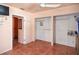 Empty bedroom with tile floors, neutral walls, and spacious closet for storage at 100 94Th Ave, Treasure Island, FL 33706