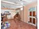 Unfurnished living room features tile flooring, neutral walls, and abundant natural light at 100 94Th Ave, Treasure Island, FL 33706