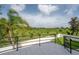 Backyard boasts stunning views of lush greenery and features an elegant patio and black aluminum fencing at 11313 Knights Griffin Rd, Thonotosassa, FL 33592