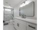Modern bathroom with glass shower and black hardware at 11313 Knights Griffin Rd, Thonotosassa, FL 33592