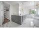 Spacious bathroom with double vanity, a large glass-enclosed shower, and a walk-in closet at 11313 Knights Griffin Rd, Thonotosassa, FL 33592