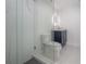 Modern bathroom includes marble-tiled shower, vanity sink and toilet at 11313 Knights Griffin Rd, Thonotosassa, FL 33592