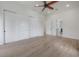 Spacious bedroom features wood floors, recessed lights, and multiple closets at 11313 Knights Griffin Rd, Thonotosassa, FL 33592
