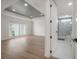 Bright bedroom with en-suite bathroom and hardwood floors at 11313 Knights Griffin Rd, Thonotosassa, FL 33592