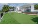 Beautiful modern home with putting green and pool at 11313 Knights Griffin Rd, Thonotosassa, FL 33592