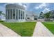 Expansive modern home featuring a well manicured yard and beautiful architecture at 11313 Knights Griffin Rd, Thonotosassa, FL 33592