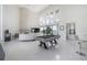 Spacious game room features a pool table and modern decor at 11313 Knights Griffin Rd, Thonotosassa, FL 33592