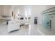 Beautiful living room with a curved sofa and sleek design elements at 11313 Knights Griffin Rd, Thonotosassa, FL 33592