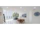 Bright living room boasts large windows with water views, dining area, and modern decor at 11313 Knights Griffin Rd, Thonotosassa, FL 33592