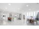 Large open floor plan showcasing the modern kitchen and living area with water views at 11313 Knights Griffin Rd, Thonotosassa, FL 33592