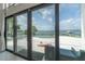 View from the patio showcasing pool and waterfront views at 11313 Knights Griffin Rd, Thonotosassa, FL 33592