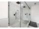 Modern bathroom features a glass-enclosed shower with dual showerheads and marble tiling at 11313 Knights Griffin Rd, Thonotosassa, FL 33592