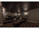 Home theater room with plush seating and a starry night ceiling at 11313 Knights Griffin Rd, Thonotosassa, FL 33592