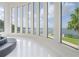 Breathtaking water view framed by the wall of modern, sleek, floor to ceiling windows at 11313 Knights Griffin Rd, Thonotosassa, FL 33592