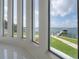 Stunning water view seen through modern window features with the boat dock visible at 11313 Knights Griffin Rd, Thonotosassa, FL 33592
