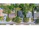 Aerial view of the home showcasing the neighborhood, landscaping, and fenced-in backyard at 1213 E Lemon St, Tarpon Springs, FL 34689