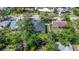 Overhead view of the home and a white fenced in backyard at 1213 E Lemon St, Tarpon Springs, FL 34689