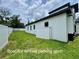Side yard with a fenced in area for a boat or RV at 1213 E Lemon St, Tarpon Springs, FL 34689