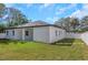 Expansive backyard with a double gate, perfect for parking an RV or boat at 1213 E Lemon St, Tarpon Springs, FL 34689
