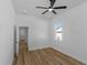 Bright bedroom featuring wood floors, natural light, and an open doorway at 1213 E Lemon St, Tarpon Springs, FL 34689