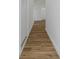 Hallway with hardwood floors and white trim offers an elegant and spacious design at 1213 E Lemon St, Tarpon Springs, FL 34689