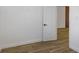 Hallway with wood floors leading to a living area; bright and modern at 1213 E Lemon St, Tarpon Springs, FL 34689
