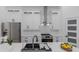 Modern kitchen features white cabinets, stainless steel appliances, and a sleek sink at 1213 E Lemon St, Tarpon Springs, FL 34689