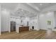Bright, open kitchen featuring stainless steel appliances, an island, and modern finishes at 1213 E Lemon St, Tarpon Springs, FL 34689