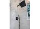 Shower boasts marble-look tile, black hardware, and a window for natural light at 1213 E Lemon St, Tarpon Springs, FL 34689
