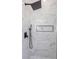 Modern shower with marble tiling, black fixtures, and recessed shelving at 1213 E Lemon St, Tarpon Springs, FL 34689