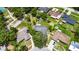 Aerial view of the property showcasing the home, lot size, surrounding neighborhood, and mature trees at 1237 Oak Valley Dr, Seffner, FL 33584