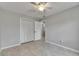 Bright bedroom with tile flooring, a ceiling fan, a closet, and neutral-colored walls at 1237 Oak Valley Dr, Seffner, FL 33584