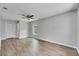 Spacious bedroom features wood-look floors, a ceiling fan, and a window for natural light at 1237 Oak Valley Dr, Seffner, FL 33584