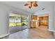 Dining area with a view of the kitchen and screened-in lanai with backyard at 1237 Oak Valley Dr, Seffner, FL 33584