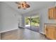 Dining area with wood-look floors and sliding glass doors to the screened-in lanai at 1237 Oak Valley Dr, Seffner, FL 33584