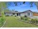 Charming single-story home featuring a well-maintained lawn and neutral gray painted brick facade at 1237 Oak Valley Dr, Seffner, FL 33584