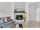 Cozy living room with a charming fireplace, tiled floors and a comfortable couch at 1237 Oak Valley Dr, Seffner, FL 33584