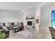 Spacious living room with tiled floors and a floor-to-ceiling fireplace at 1237 Oak Valley Dr, Seffner, FL 33584