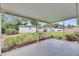 Covered patio perfect for enjoying the green backyard and a shed for outdoor storage at 1237 Oak Valley Dr, Seffner, FL 33584