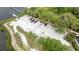 Aerial view highlighting boat storage facility along the waterfront with serene community views at 1237 Windy Bay Shl, Tarpon Springs, FL 34689